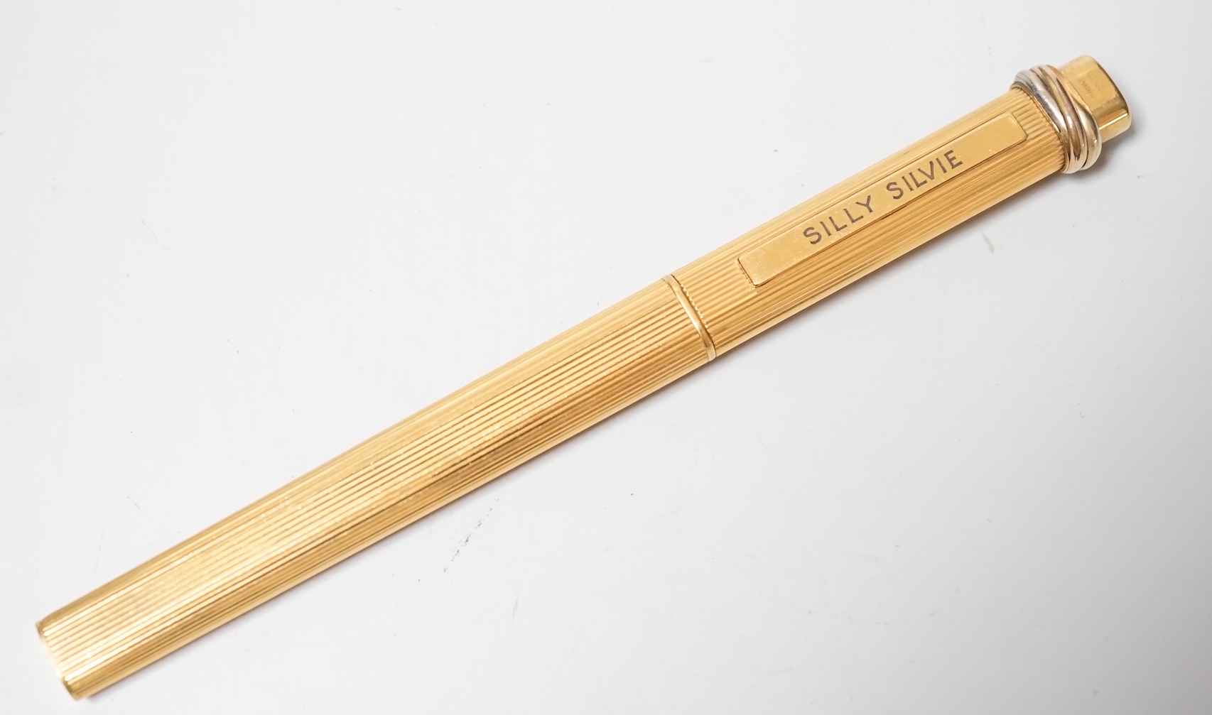 A Cartier gold plated pen, the clip engraved ‘Silly Silvie’